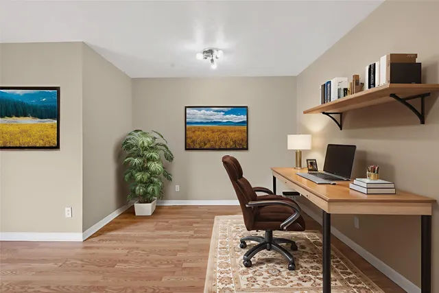 a workspace with furniture and screen