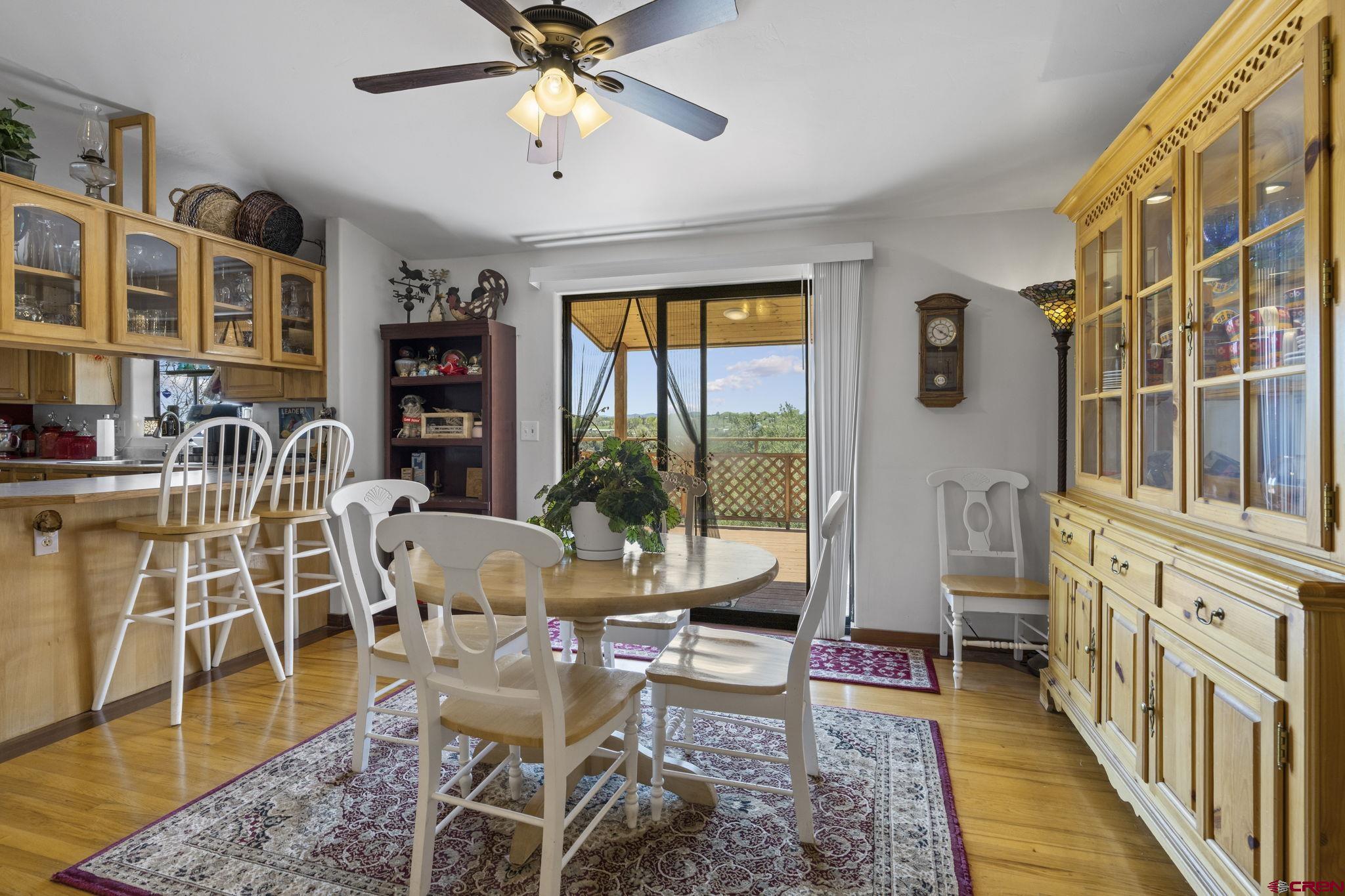 45 Pine Ridge Road Durango, CO 81301 - Photo 11 of 44 a living room with furniture and a floor to ceiling window
