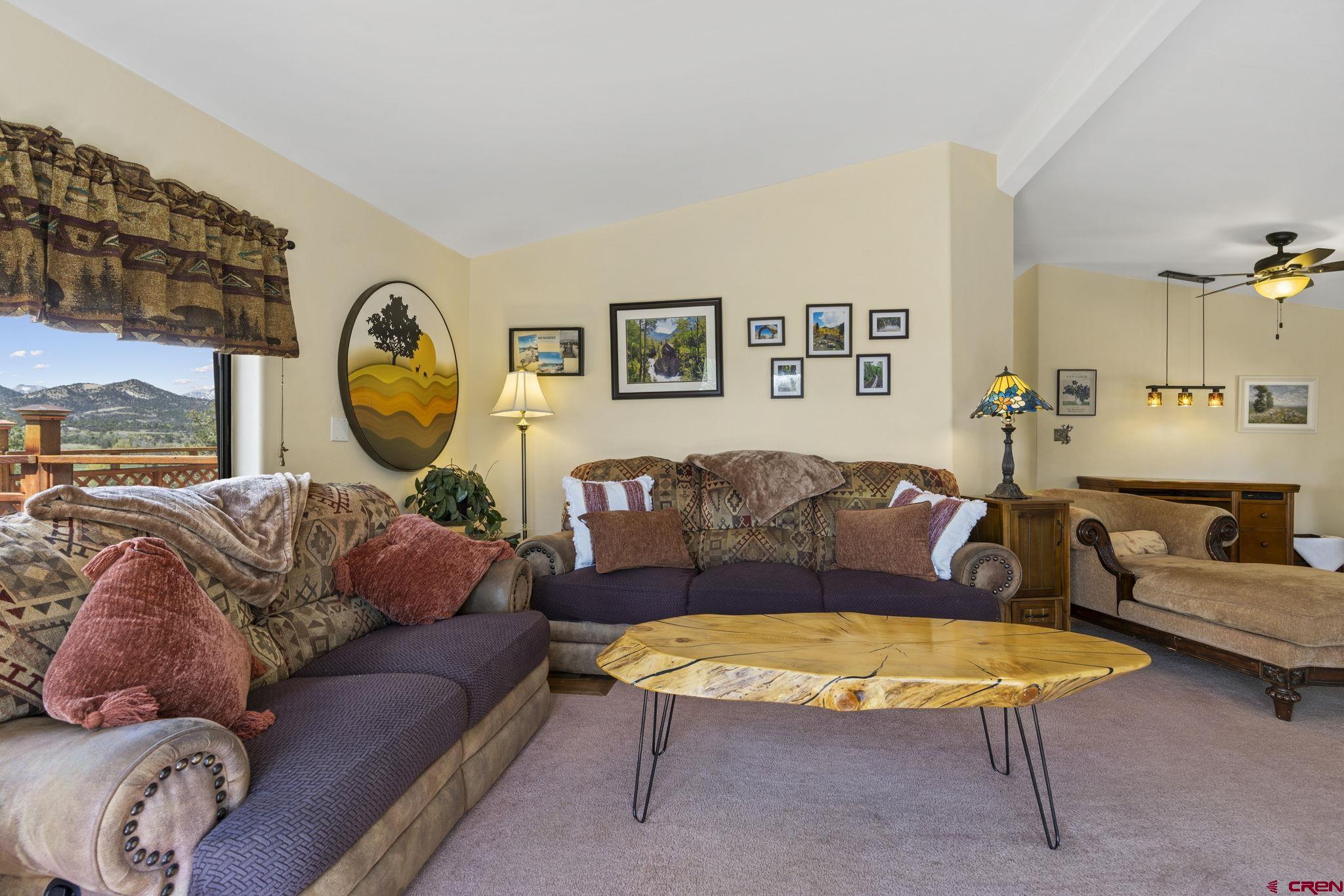 45 Pine Ridge Road Durango, CO 81301 - Photo 15 of 44 a living room with furniture and a large window