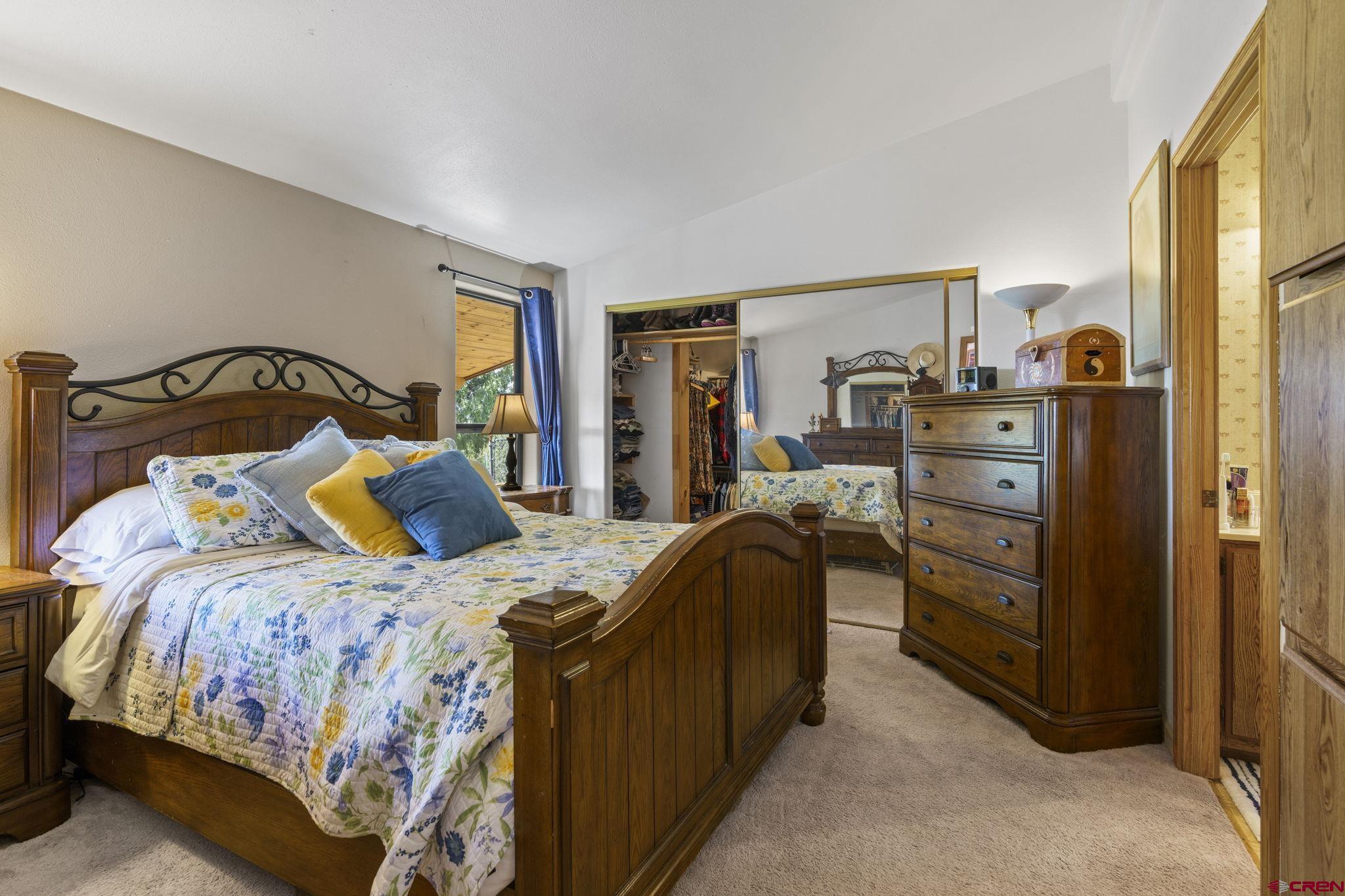 45 Pine Ridge Road Durango, CO 81301 - Photo 20 of 44 a bedroom with a bed and furniture