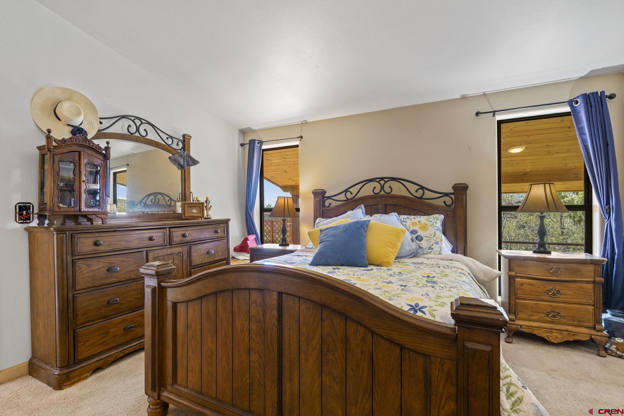 45 Pine Ridge Road Durango, CO 81301 - Photo 21 of 44 a bedroom with a bed and a dresser