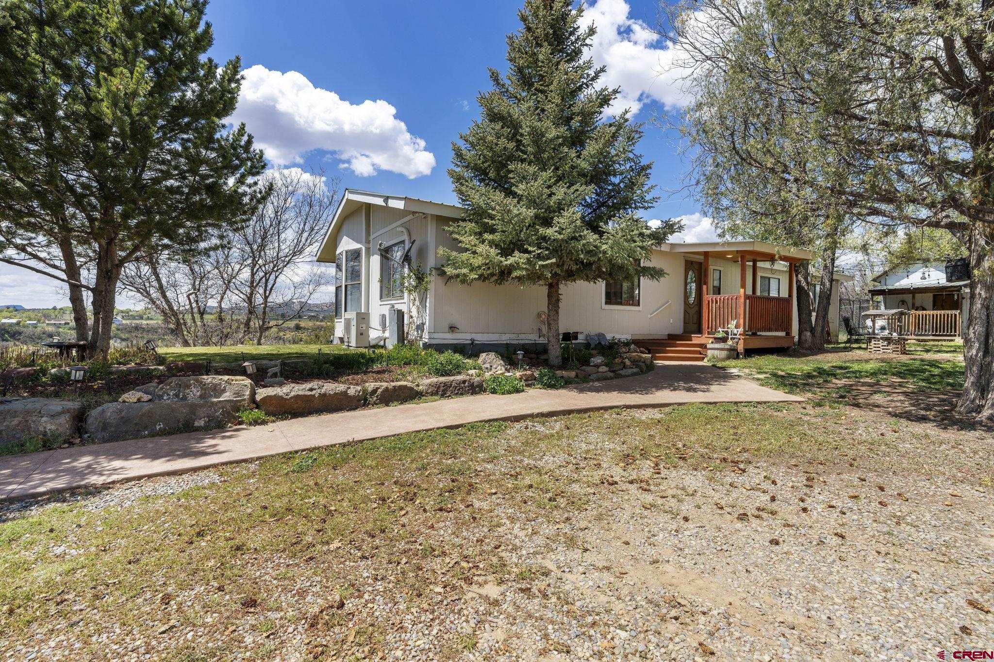45 Pine Ridge Road Durango, CO 81301 - Photo 38 of 44 a view of a house with a yard and tree s