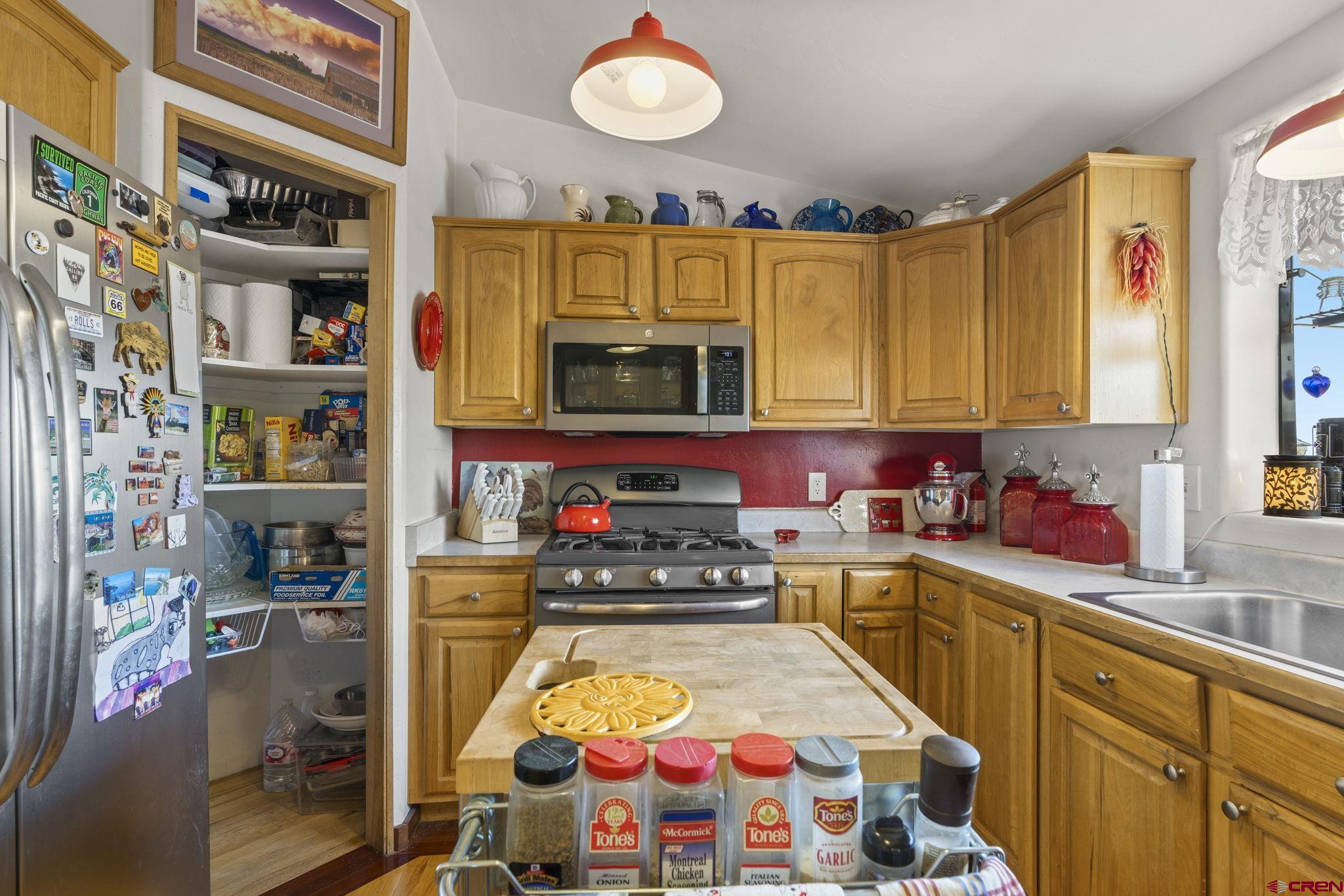 45 Pine Ridge Road Durango, CO 81301 - Photo 8 of 44 a kitchen with stainless steel appliances a stove a sink and a microwave