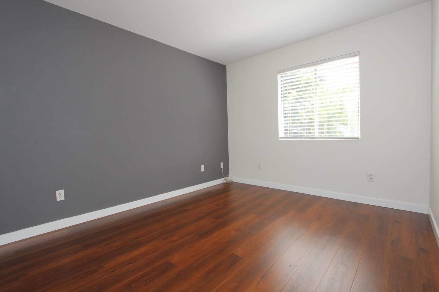 3708 Didcot Circle Sacramento, CA 95838 - Photo 19 of 23 a view of an empty room with wooden floor and a window
