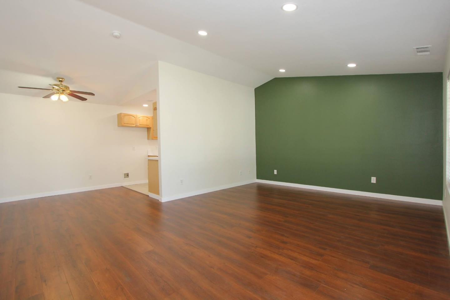 3708 Didcot Circle Sacramento, CA 95838 - Photo 2 of 23 a view of a livingroom with a ceiling fan and wooden floor