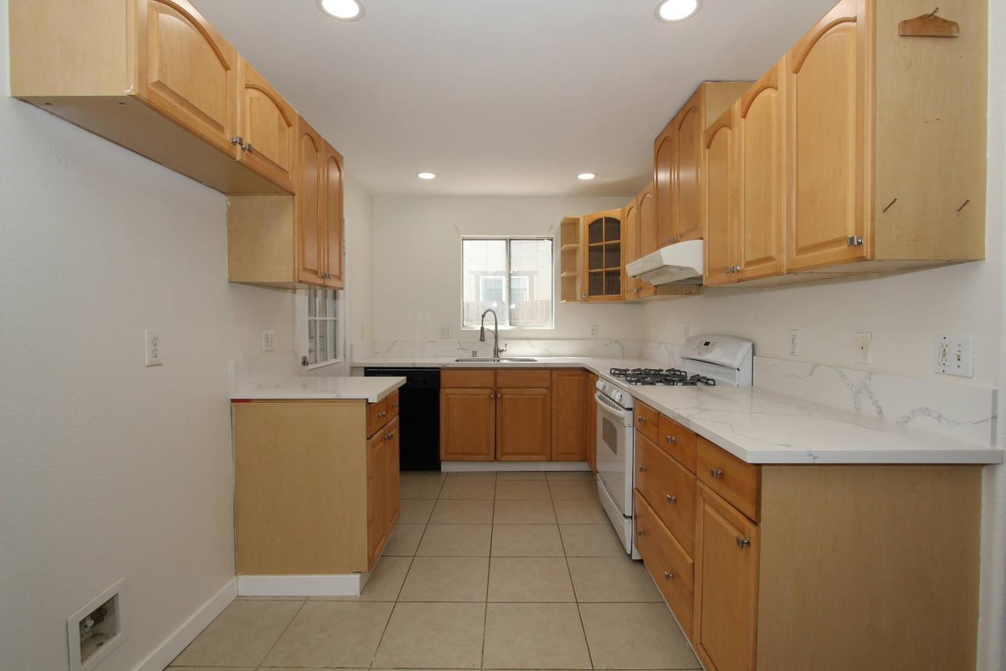 3708 Didcot Circle Sacramento, CA 95838 - Photo 4 of 23 a kitchen with stainless steel appliances granite countertop a sink stove and refrigerator