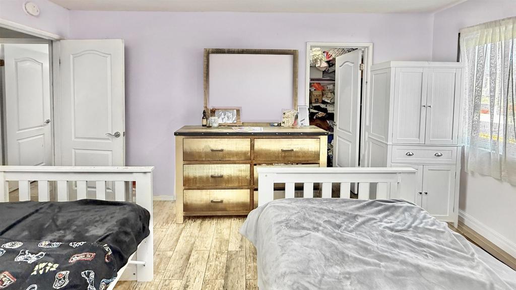 10235 Madrid Way, Unit 114 Spring Valley, CA 91977 - Photo 11 of 26 a bedroom with furniture and a window