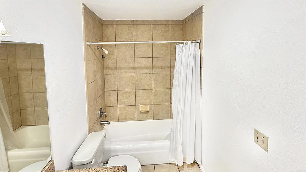 10235 Madrid Way, Unit 114 Spring Valley, CA 91977 - Photo 15 of 26 a bathroom with a bathtub and shower