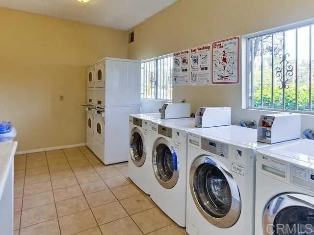 10235 Madrid Way, Unit 114 Spring Valley, CA 91977 - Photo 18 of 26 a utility room with dryer and washer