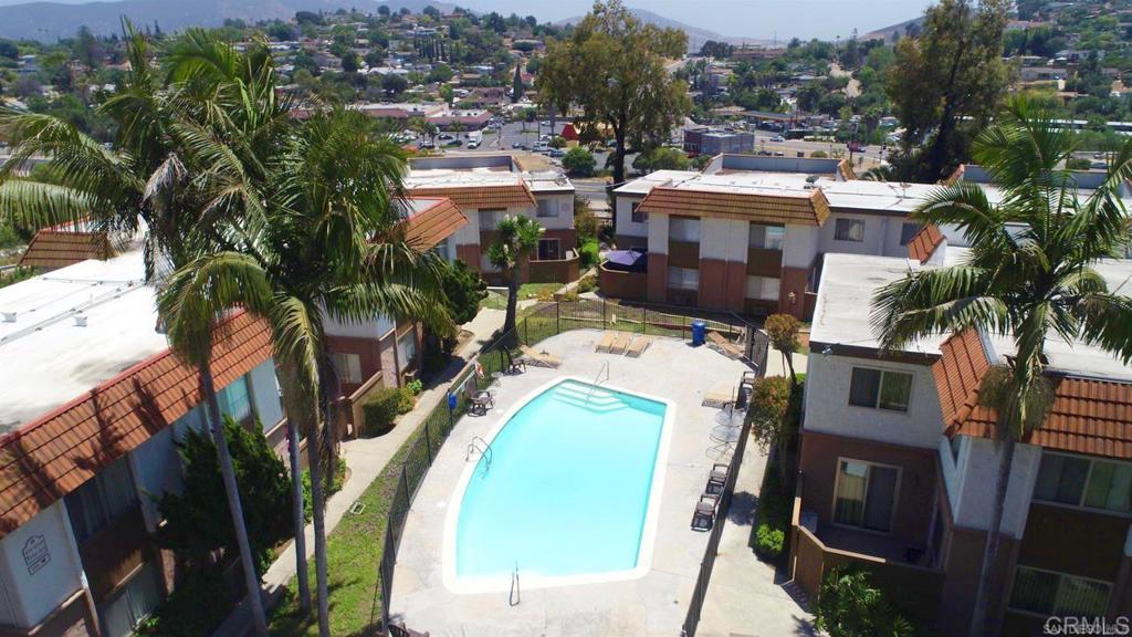 10235 Madrid Way, Unit 114 Spring Valley, CA 91977 - Photo 21 of 26 an aerial view of a house with a swimming pool and outdoor seating