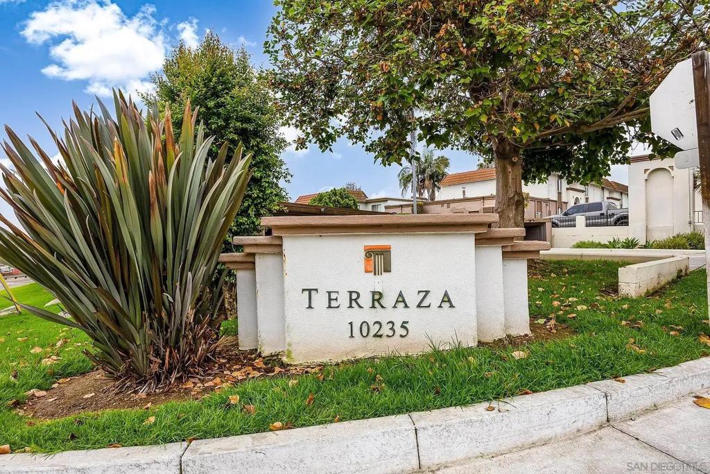 10235 Madrid Way, Unit 114 Spring Valley, CA 91977 - Photo 25 of 26 a front view of a house with garden