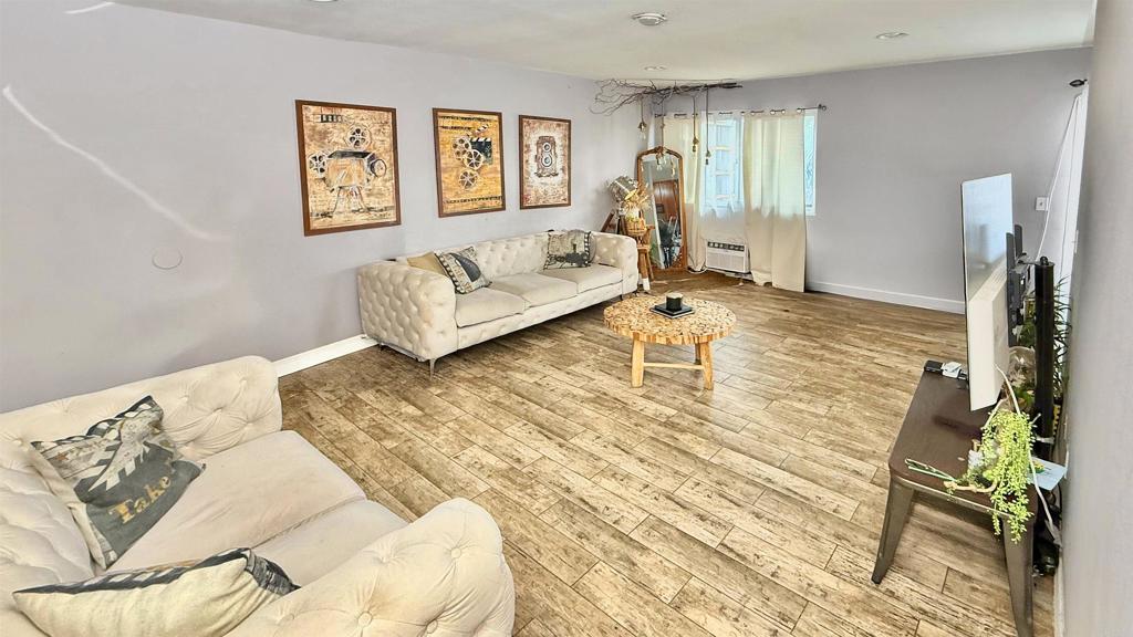 10235 Madrid Way, Unit 114 Spring Valley, CA 91977 - Photo 3 of 26 a living room with furniture and a couch