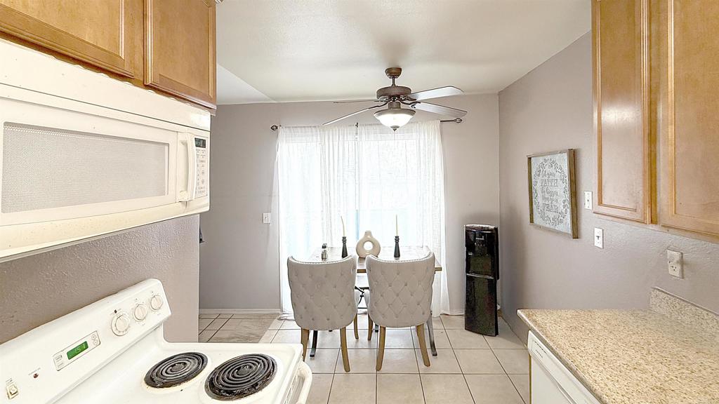 10235 Madrid Way, Unit 114 Spring Valley, CA 91977 - Photo 9 of 26 a view of a kitchen and a window