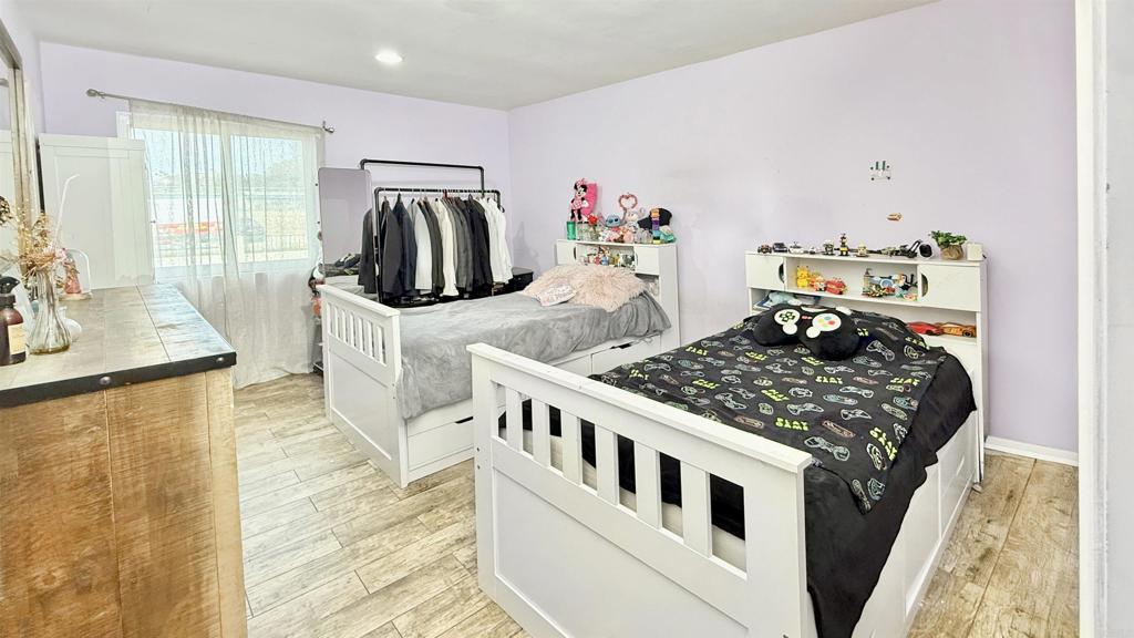 10235 Madrid Way, Unit 114 Spring Valley, CA 91977 - Photo 10 of 26 a bedroom with furniture and a window