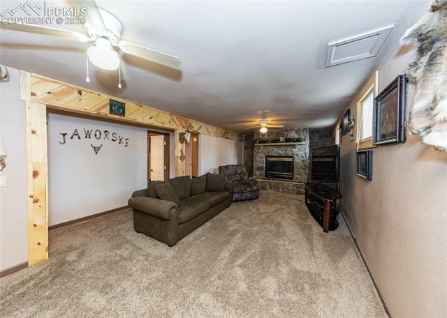 6727 Seneca Road Colorado Springs, CO 80915 - Photo 27 of 50 Custom wood beams and two ceiling fans!