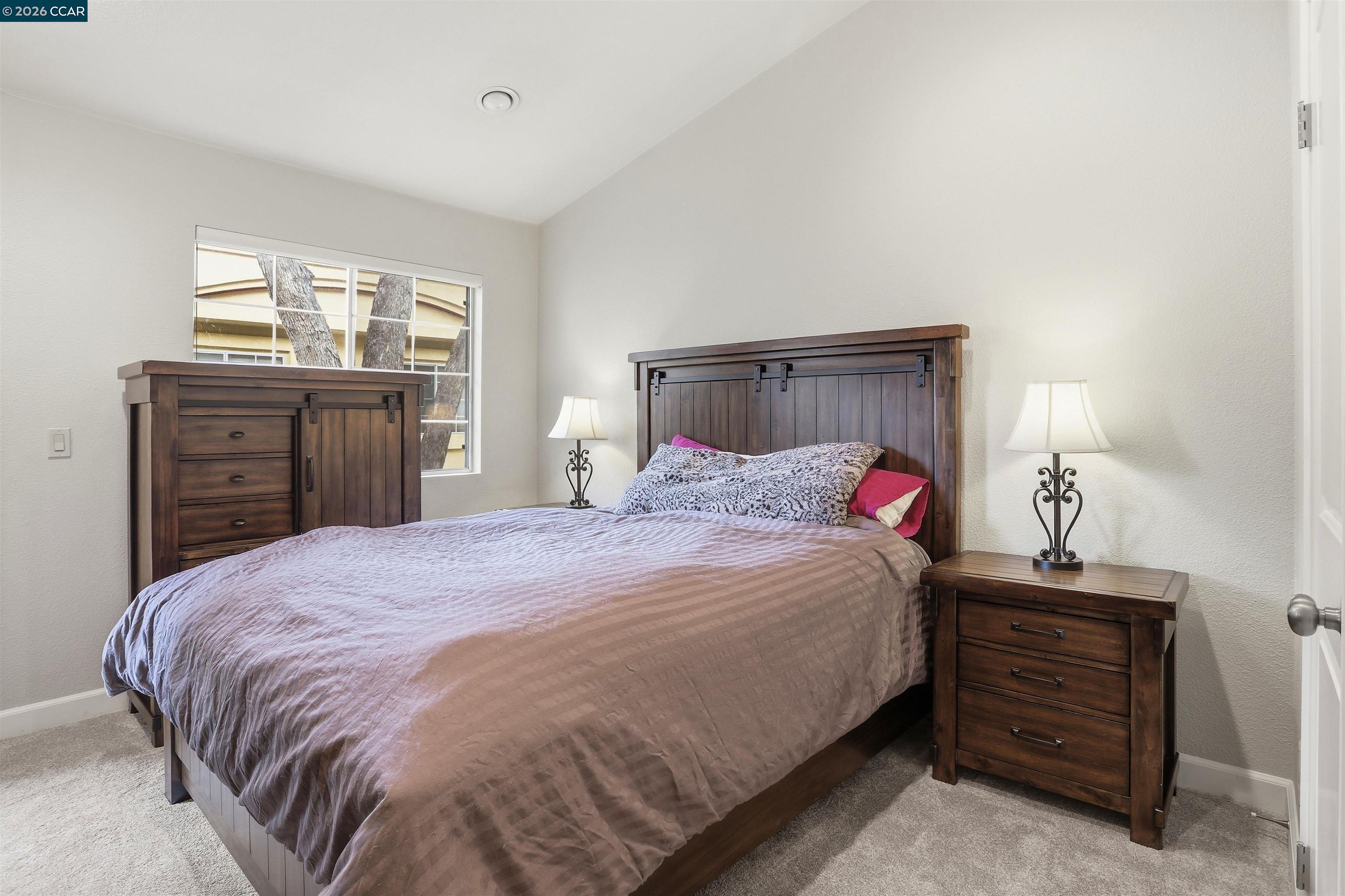 7020 Stagecoach Road, Unit G Dublin, CA 94568 - Photo 11 of 21 a bedroom with a bed and a dresser