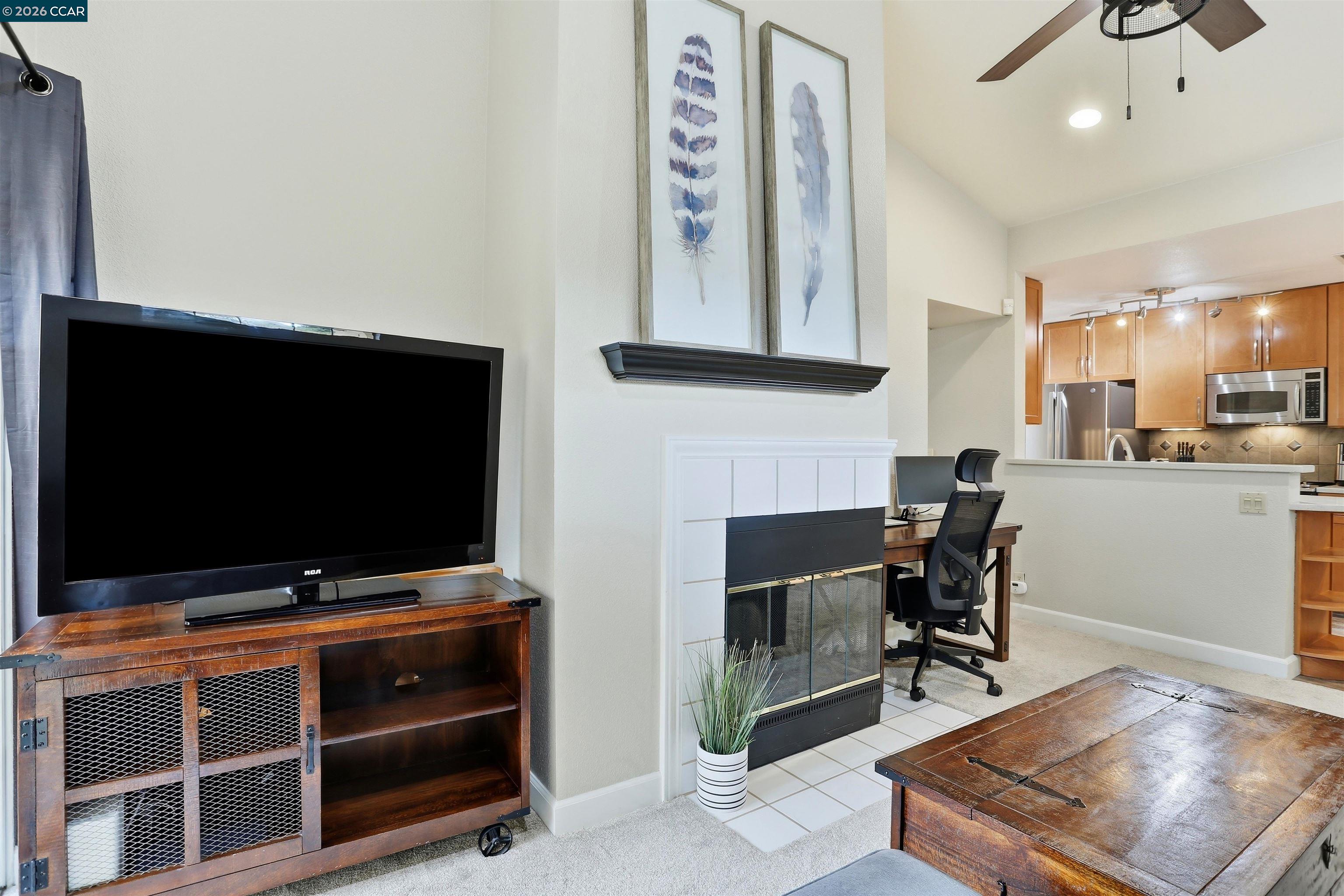 7020 Stagecoach Road, Unit G Dublin, CA 94568 - Photo 15 of 21 a living room with furniture and a flat screen tv