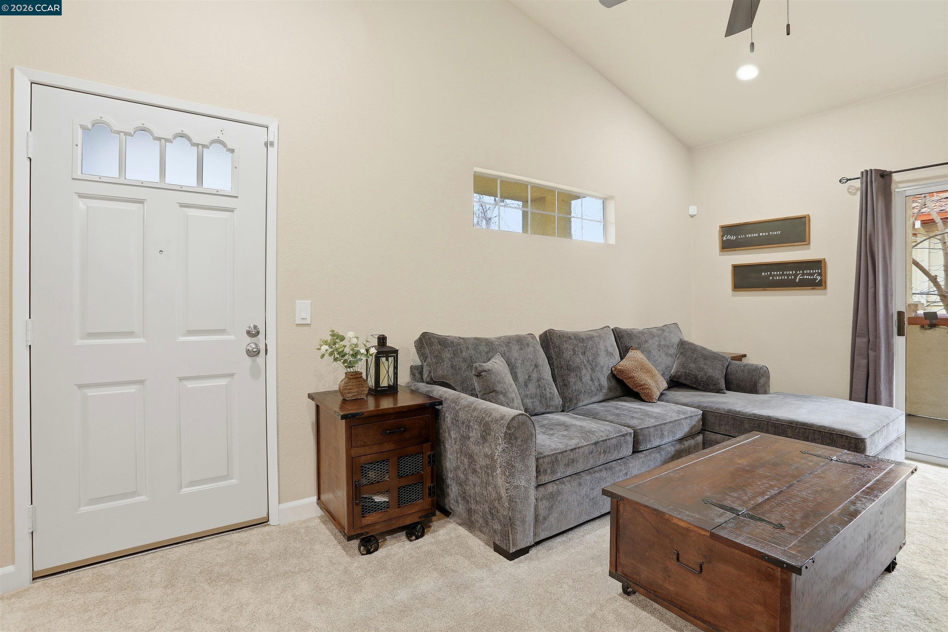 7020 Stagecoach Road, Unit G Dublin, CA 94568 - Photo 2 of 21 a living room with furniture and a flat screen tv