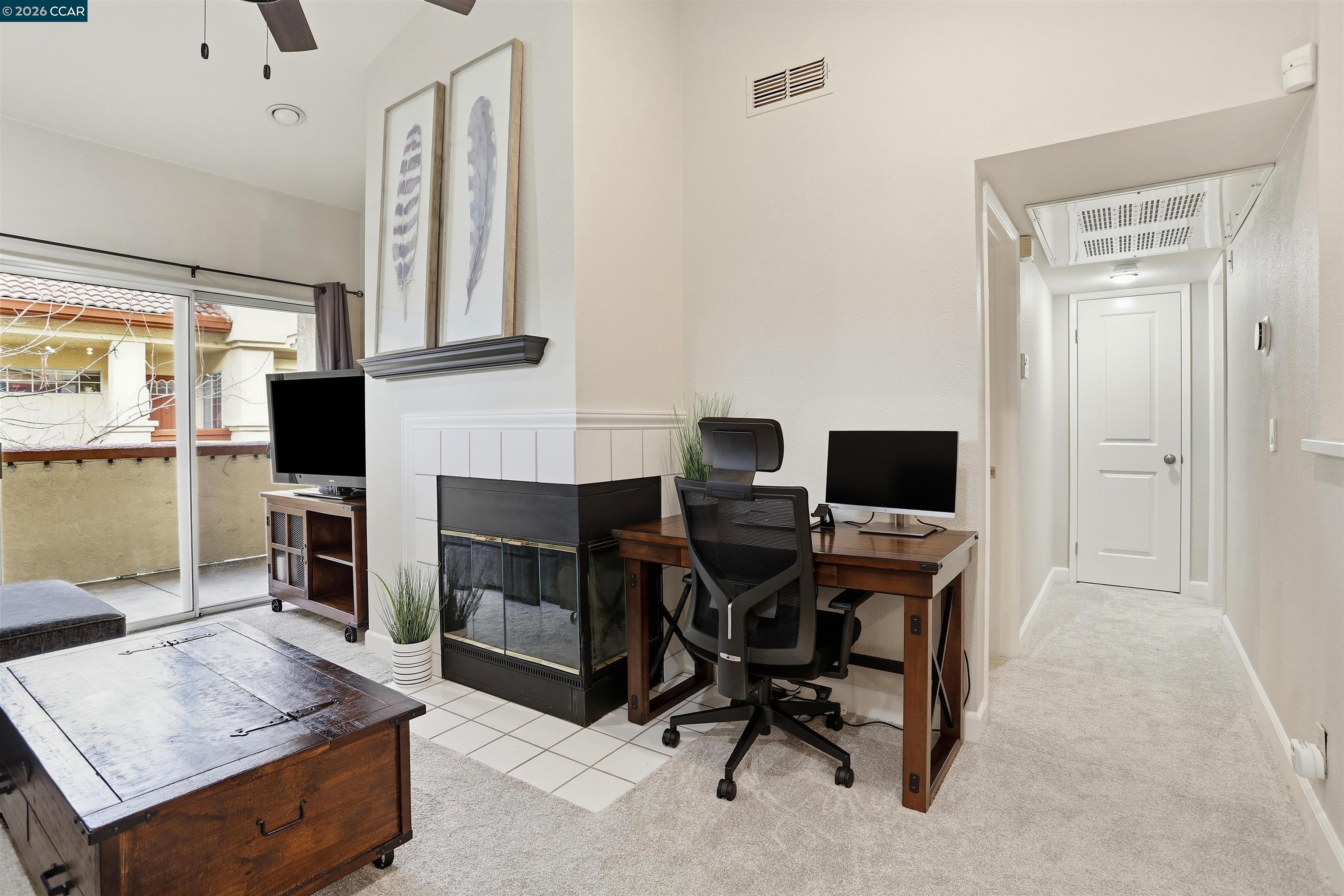 7020 Stagecoach Road, Unit G Dublin, CA 94568 - Photo 5 of 21 a view of a workspace with furniture and a fireplace