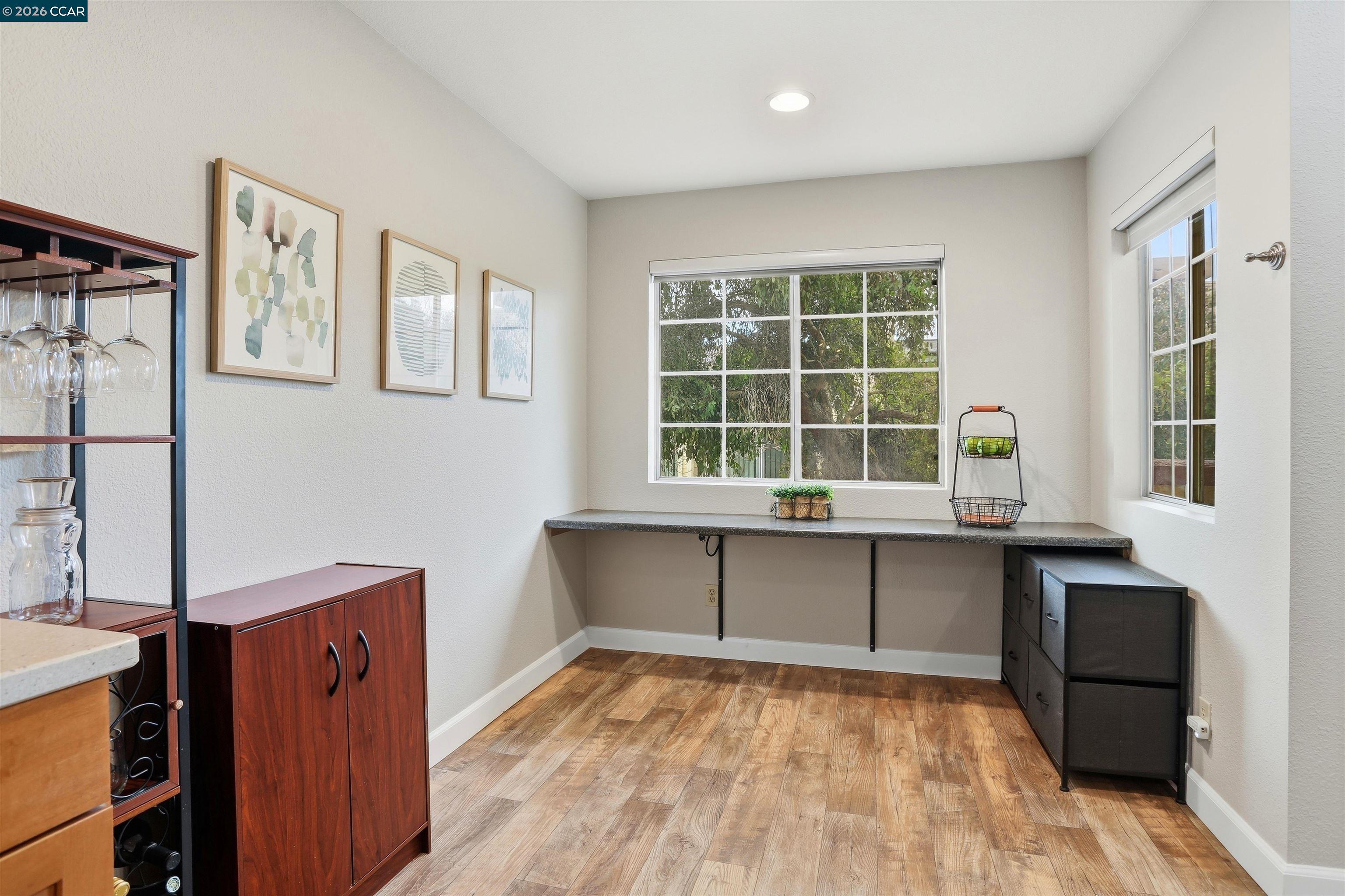 7020 Stagecoach Road, Unit G Dublin, CA 94568 - Photo 7 of 21 a living room with stainless steel appliances granite countertop a stove and a sink