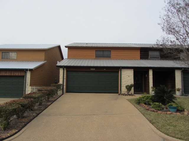 1914 20th Street Huntsville, TX 77340 - Photo 1 of 23 a front view of house with yard and garage