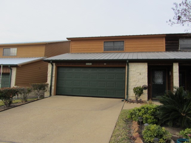 1914 20th Street Huntsville, TX 77340 - Photo 2 of 23 a front view of a house with a yard