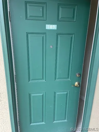 a white refrigerator freezer and a stove sitting inside of a kitchen