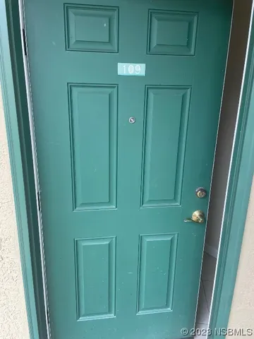 a white refrigerator freezer and a stove sitting inside of a kitchen