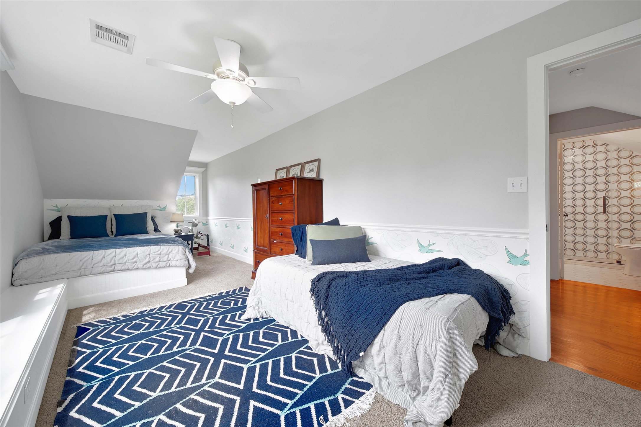 18875 Rabon Chapel Road Montgomery, TX 77316 - Photo 31 of 45 a bedroom with a bed and wooden floor