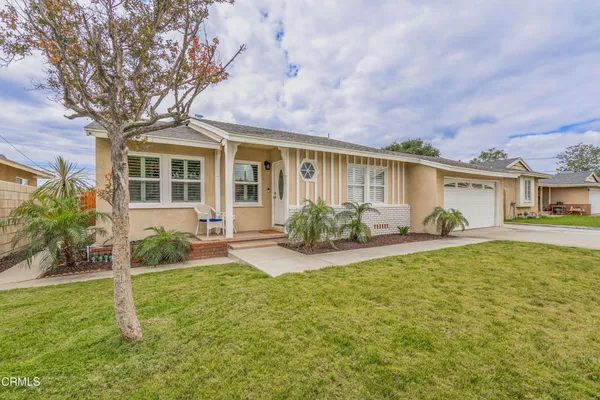 front view of a house with a yard