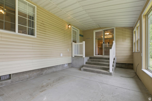 435 East 4th North Preston, ID 83263 - Photo 17 of 26 Covered patio area featuring concrete flooring, horizontal siding, and a white paneled ceiling