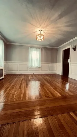 a view of room with wooden floor