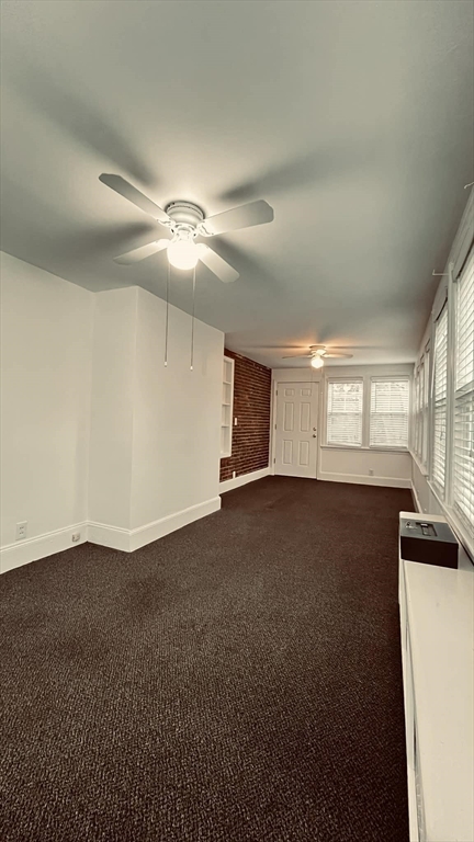 21 Lawrence Lane Belmont, MA 02478 - Photo 5 of 13 a view of an empty room with a window