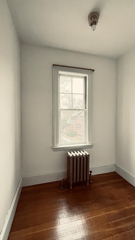 21 Lawrence Lane Belmont, MA 02478 - Photo 10 of 13 an empty room with wooden floor and windows