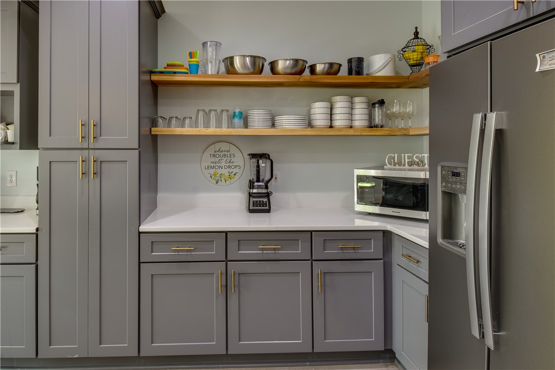 206 Petty Road Seneca, SC 29672 - Photo 9 of 48 Clean lines and ample storage define this contemporary kitchen prep area.