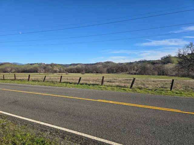 a view of an ocean beach and mountain