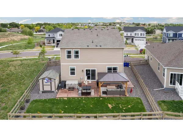 an aerial view of a house with a garden and plants