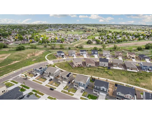 an aerial view of a house with a garden