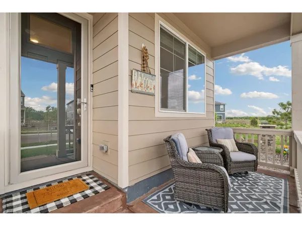 a view of a balcony with furniture