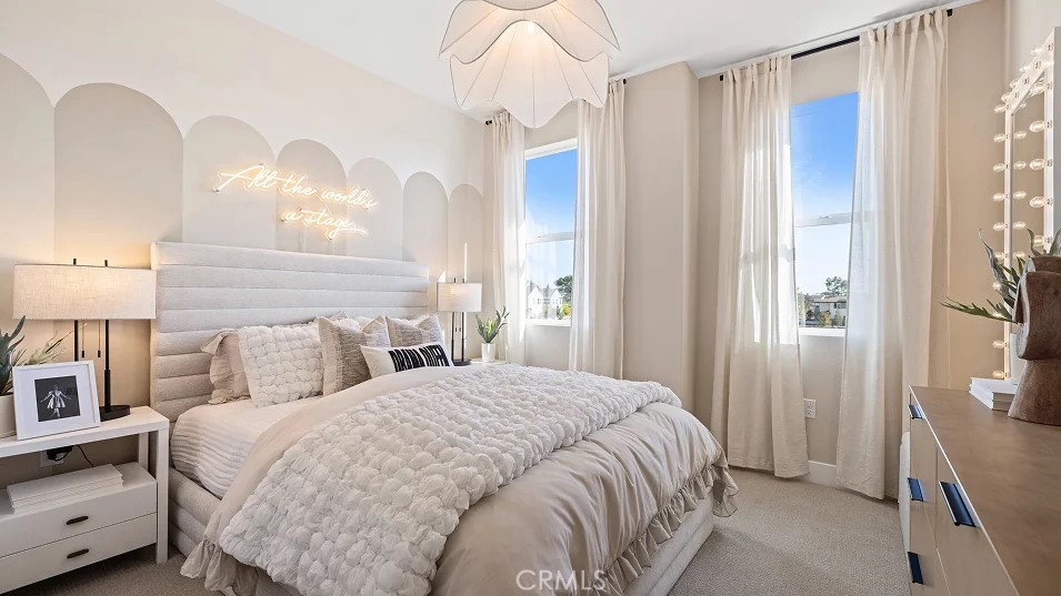 15 Merit Irvine, CA 92618 - Photo 14 of 33 a bedroom with a bed and a chandelier