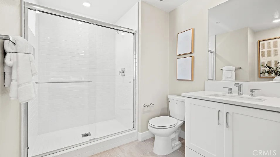15 Merit Irvine, CA 92618 - Photo 16 of 33 a bathroom with a toilet a sink and shower