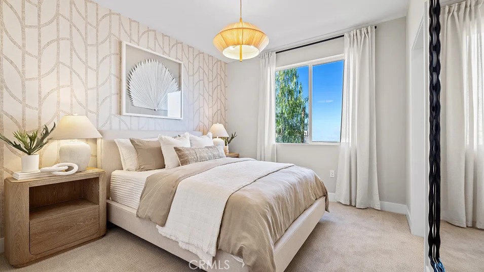 15 Merit Irvine, CA 92618 - Photo 19 of 33 a bedroom with a bed and a chandelier