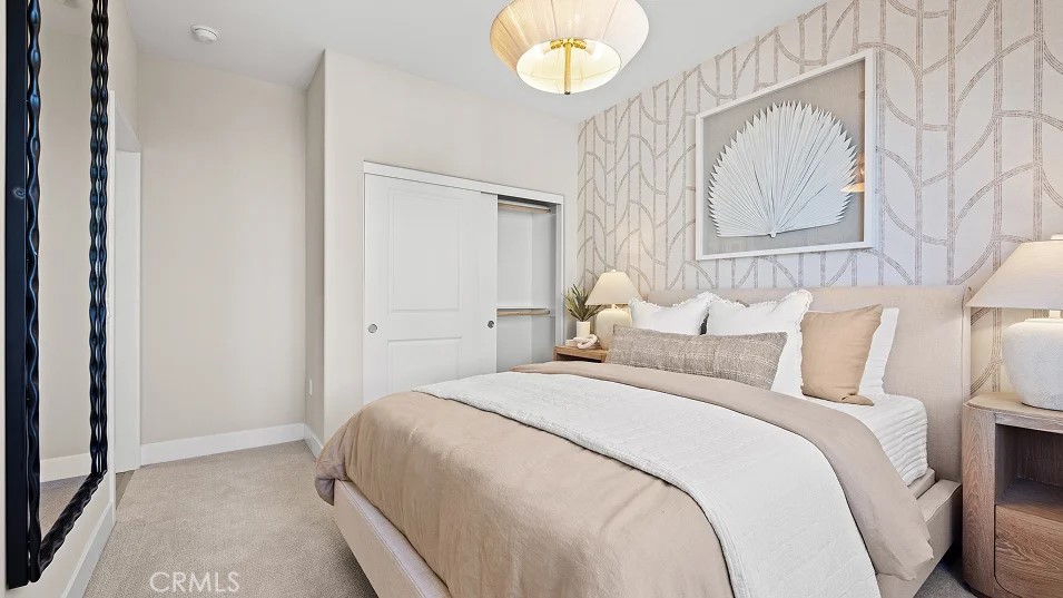 15 Merit Irvine, CA 92618 - Photo 20 of 33 a bedroom with bed and a chandelier