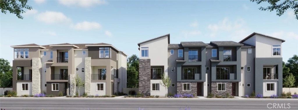 15 Merit Irvine, CA 92618 - Photo 23 of 33 a front view of a residential apartment building with a yard