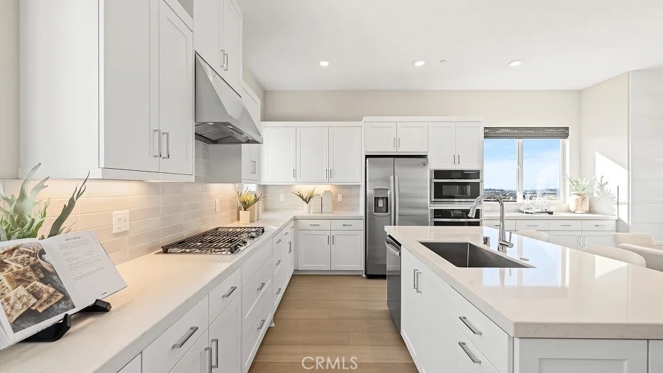 15 Merit Irvine, CA 92618 - Photo 3 of 33 a kitchen with a sink stove top oven and refrigerator