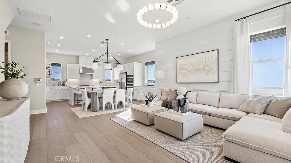 15 Merit Irvine, CA 92618 - Photo 6 of 33 a living room with furniture kitchen view and a wooden floor