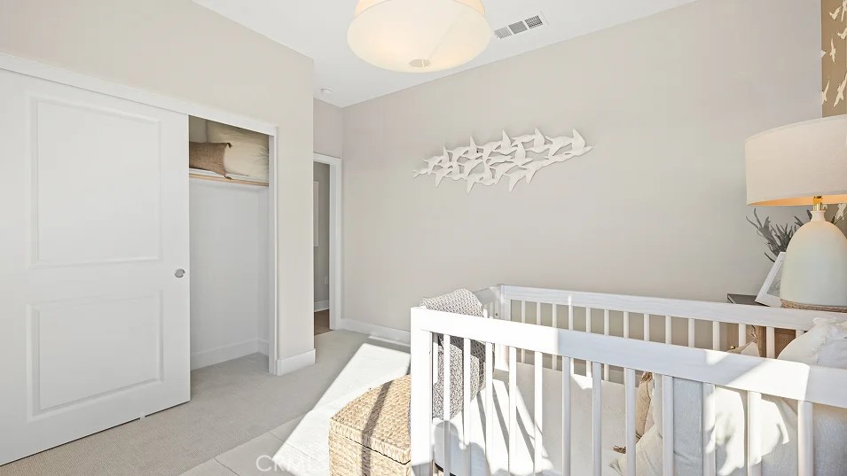 15 Merit Irvine, CA 92618 - Photo 8 of 33 a view of a bedroom with furniture and wooden floor