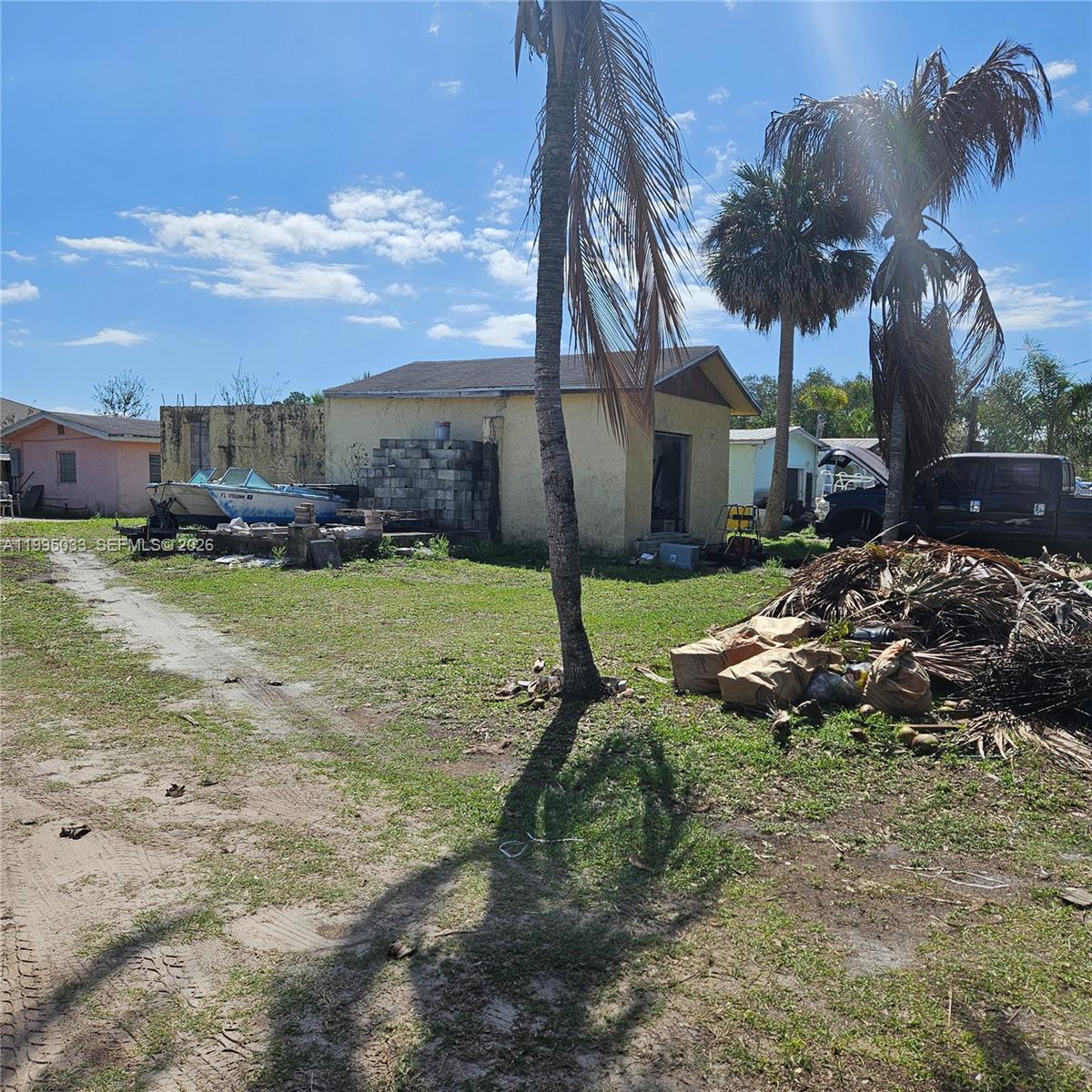 5735 Southeast Green Lane Stuart, FL 34997 - Photo 3 of 4 a view of a house with a yard