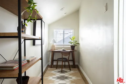 a view of entryway with a window and wooden floor