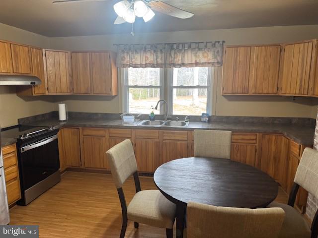 9285 Old Stagecoach Road La Plata, MD 20646 - Photo 5 of 14 a kitchen with a table chairs sink and cabinets